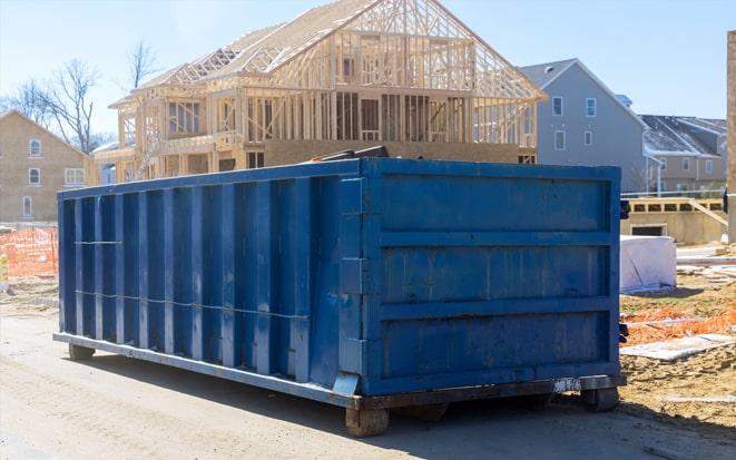 dumpster in driveway for home renovation